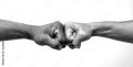 man-giving-fist-bump-monochrome-black-and-white-image-stockpack-adobe-stock.jpg